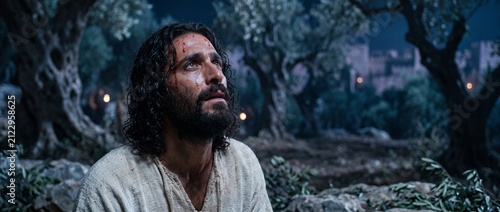 Man as Jesus praying in the Garden of Gethsemane. Religious scene showing divine struggle and surrender to God will. Biblical cinematic concept reflecting faith, sorrow and devotion.