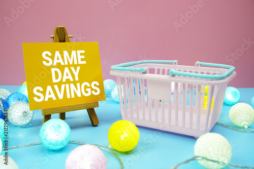 Same Day Savings text with shopping basket on blue background