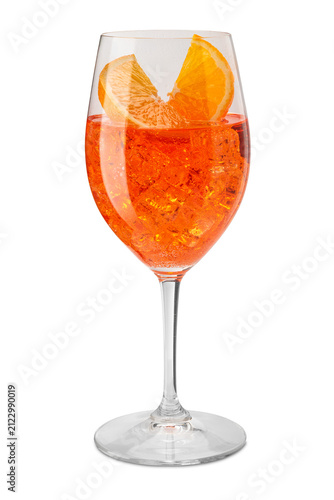 Crystal goblet wine glass with vibrant orange Aperol Spritz cocktail, packed with crushed ice cubes and garnished with two fresh orange slices, isolated  