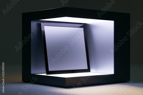 Illuminated square display frame with centered metallic panel and soft shadowing