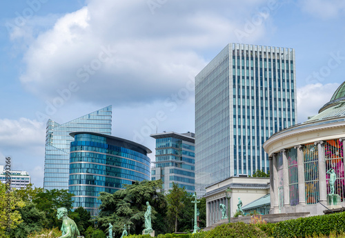 Eclectic Brussels skyline where elegant classical architecture meets iconic contemporary glass office towers, highlighting urban transformation and European business development