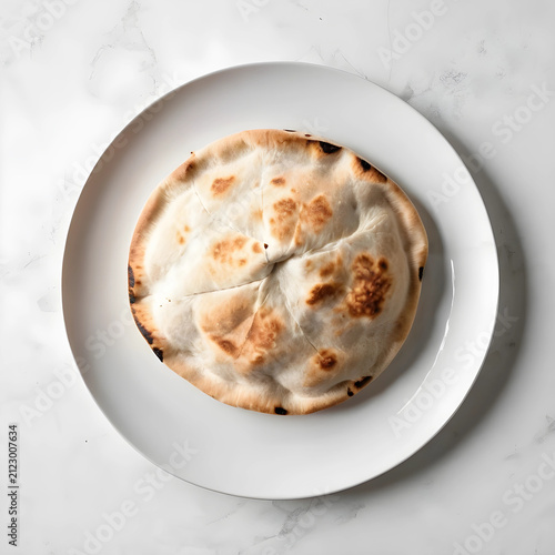 Freshly baked pita bread on...