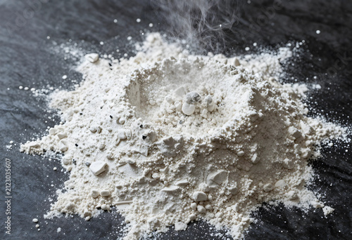 White powder pile with smal...