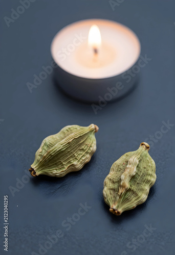 Two green cardamom pods wit...