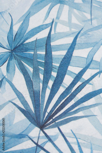 Abstract Soft Blue Tropical Palm Frond Pattern on Textured Paper Surface