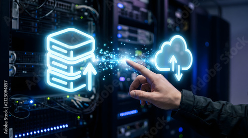 Hand connecting holographic database and cloud icons showing modern cloud computing, data storage, and digital management solutions