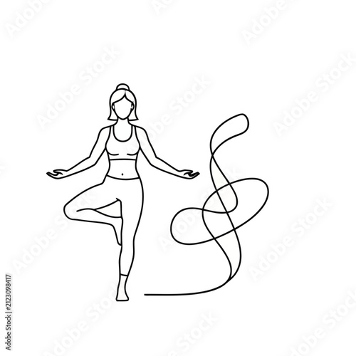 Woman in yoga tree pose with flowing ribbon