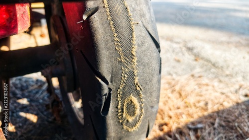 фотографія Old worn damaged tires as pattern of damaged tire