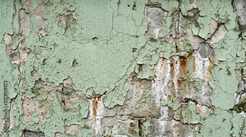 Vintage green peeling paint texture. Rusty metal background with grunge aesthetic.