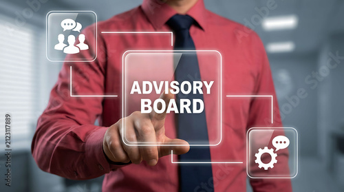 Businessman pressing virtual advisory board interface in modern office