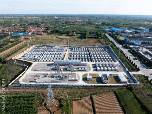 Aerial view of a large-scale energy storage power station with battery arrays and substation facilities