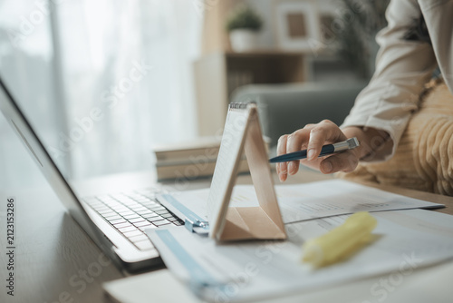This focused image brings together financial deadline, calendar planning, and financial documents. The setting supports organized records, careful decisions, responsible spending, and clear planning.