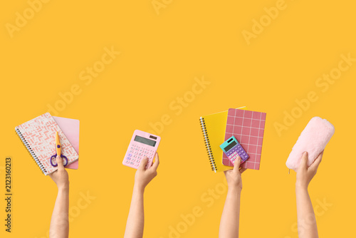 Hands holding colorful scho...