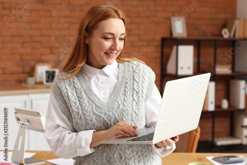 Smiling woman with red hair...