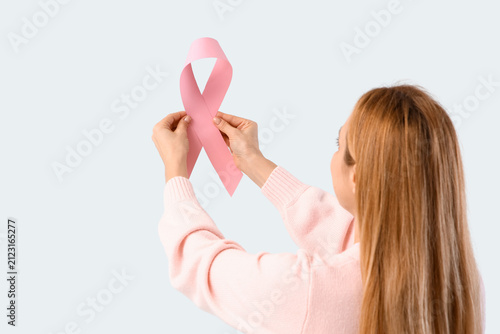 Mature woman with pink ribb...