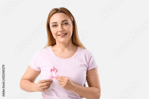 Mature woman with pink ribb...