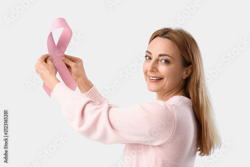 Mature woman with pink ribb...