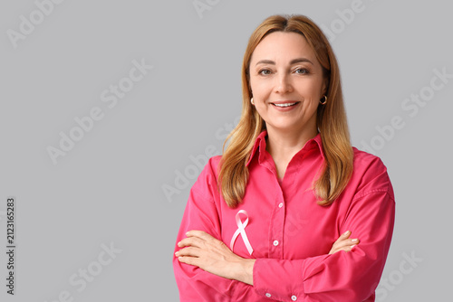 Mature woman with pink ribb...