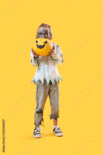 Little girl dressed as zomb...