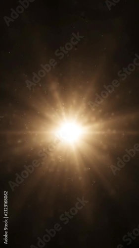 Golden starburst lens flare effect on black background