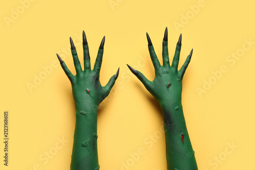 Green hands of witch with c...