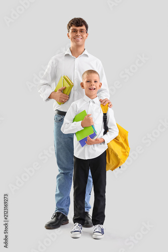 Male teacher with books and...