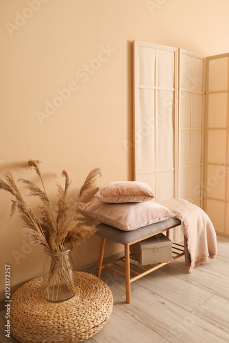 Wooden bench with soft pill...