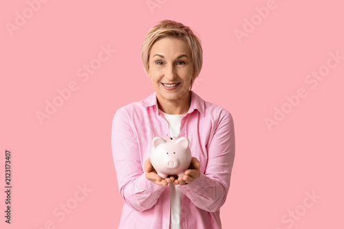 Happy mature woman with pig...