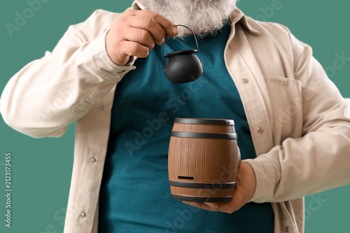 Mature man with barrel and ...
