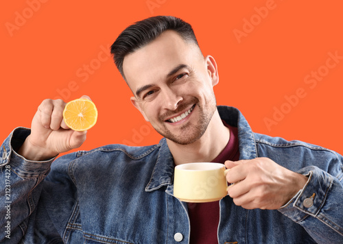 Handsome man with cup of te...
