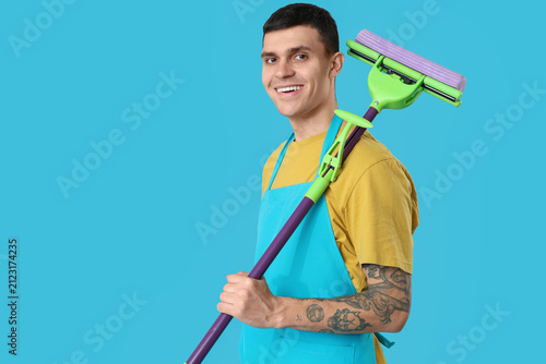 Male janitor with floor mop...