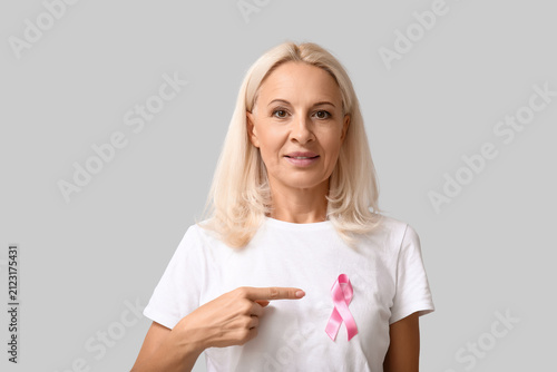 Mature woman with pink ribb...