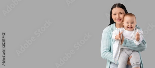 Happy young mother holding ...