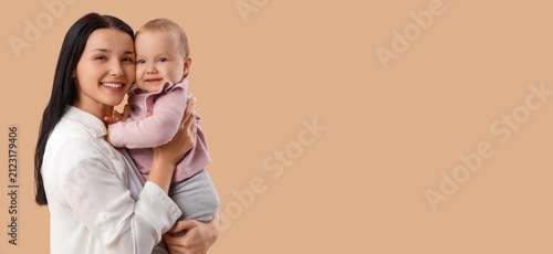 Happy young mother holding ...