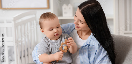 Happy young mother holding ...