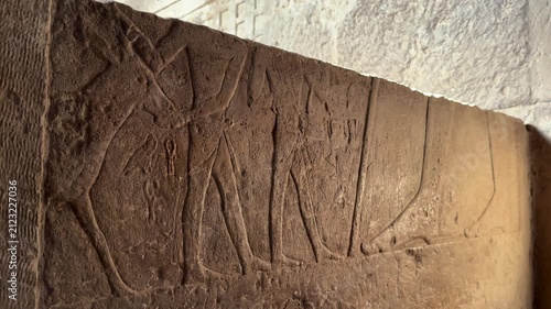 Close Up of Ancient Egyptian Wall Relief Showing Procession of Figures Inside the Mortuary Temple of Khufu at Giza Necropolis