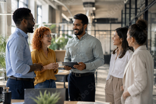 AI generated diverse professionals collaborating modern office during informal business meeting ideal for teamwork leadership communication corporate culture marketing training