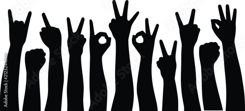 Diverse hands in silhouette showing victory peace and rock on gestures against a bright white background concept