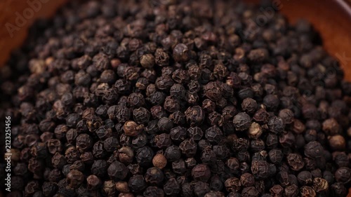 Black Peppercorns in a Wooden Bowl	