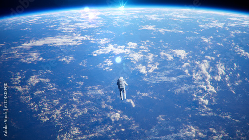 Bild auf Leinwand Wide Shot of Astronauts Performing Spacewalk in Deep Space in Zero Gravity Above Planet Earth Horizon