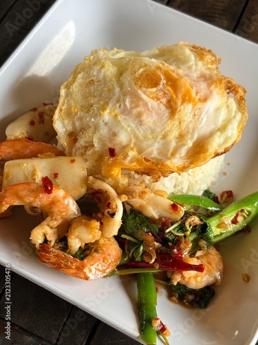 Bild auf Leinwand Authentic Thai Seafood Pad Kra Pao with Holy Basil and Rice