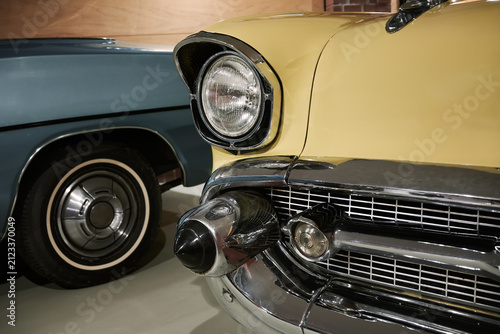 Obraz na płótnie A retro car 1950s, distinguished by its chrome grille and bullet-shaped fangs on the bumper