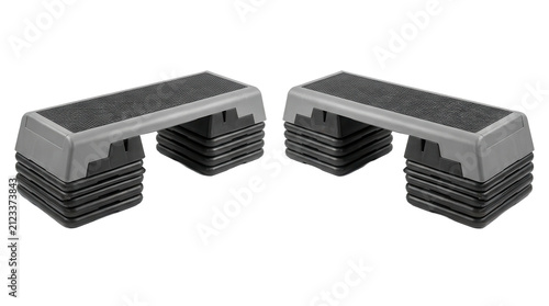 Two aerobic step platforms with textured surfaces and layered bases on transparent background exercise platform fitness