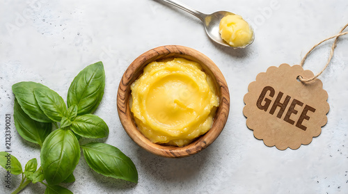 Top view of organic clarified butter or ghee in a wooden bowl prepared for traditional diwali festival cooking