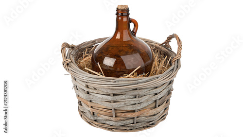 Foto Old vintage glass carboy bottle inside round wicker basket isolated on transpare