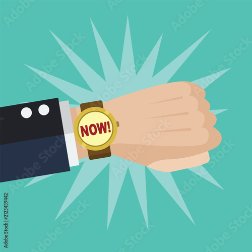 Hand wearing wrist watch with now text