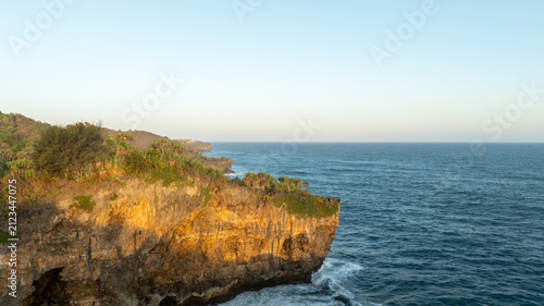 Canvastavla Aerial view of a peaceful turquoise cove nestled between forested cliffs on the secluded Ngerenean coast