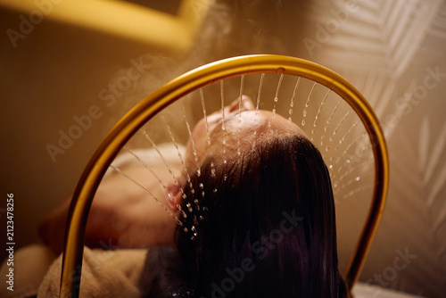 Close up of woman enjoying during Japanese head spa treatment.