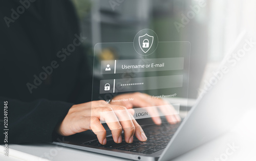 User typing login and password at home, secure access to the personal information and big data. cyber security, the digital crime concept, and data protection from hackers.