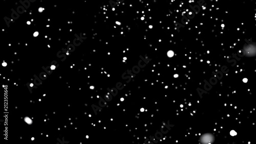 Falling snow particles on a dark background. Looped animation